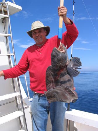 Ed, who came to fish Stellwagen Bank from Maryland, displays a large wolf fish he landed aboard RELENTLESS on Saturday, June 16th